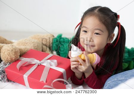 Attractive Asian Girl Playing In At Home. Kid Holding Toy With Attractive Smiling. Kid With Happy Em