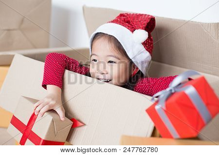 Asian Girl Holding Gift Box. Kid Holding Box With Smiling.