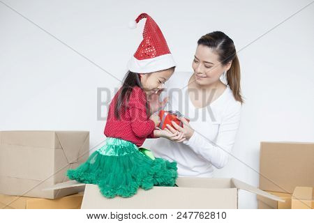 Attractive Asian Girl Received A Present From Her Mom. Kid Received Gift With Attractive Smiling. Ki