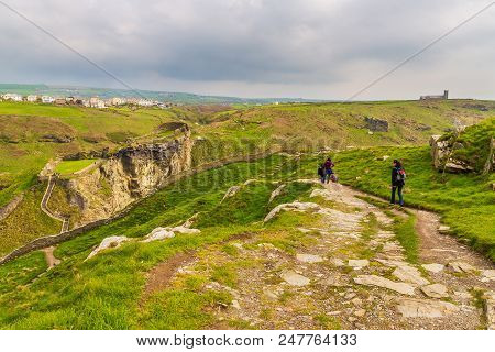 Tintagel, United Kingdom - May 02, 2014: View Of Tintagel Island And Legendary Tintagel Castle Ruins