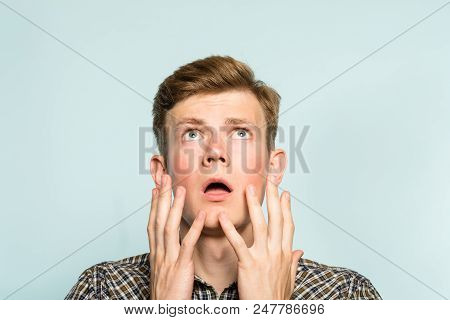Amazed Astonished Shocked Dazed Impressed Stunned Man Looking Up. Portrait Of A Young Guy On Light B