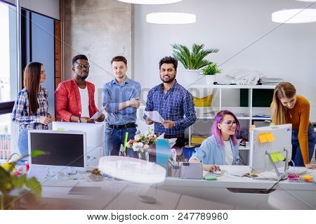 Well-lit White Open Office Space With White Furniture Computer Tables With Digital Gadgets. Multirac