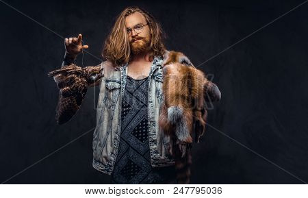 Portrait Of A Tattoed Redhead Hipster Male With Long Luxuriant Hair And Full Beard Dressed In A T-sh