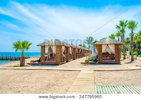 Wooden Beach Pavilions On The Shore Of A Sandy Beach - The Mediterranean Coast, Beldibi, Antalya, Tu