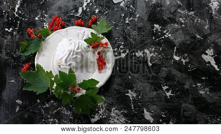 Meringue Desert With Red Berries On Plate On Dark Background. Top View. Free Copy Space.
