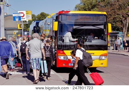 Kalmar, Sweden - June 28, 2018: Passengers At The Kalmar Central Station Enter The Public Transporta