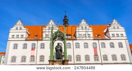 Martin Luther Statue, Colorful Market Square Rathuas Lutherstadt Wittenberg Germany. Statue From 180