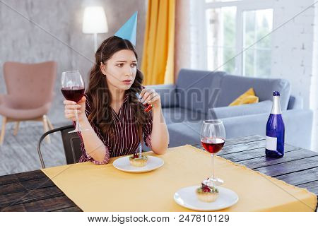 Bad Memories. Dark-haired Appealing Woman With Long Wavy Hair Having Bad Memories About Her Last Bir