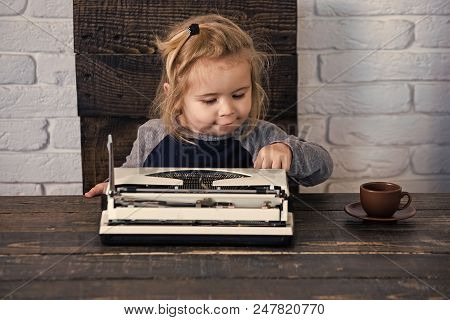 Future Of Copywriting. Kid Or Small Businessman Child Sitting At Table And Typing Typewriter With Co