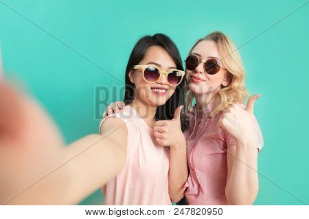 Mixed Races Young Women Beauty Portrait Caucasian And Asian Two Girls Wearing Sunglasses Making Self