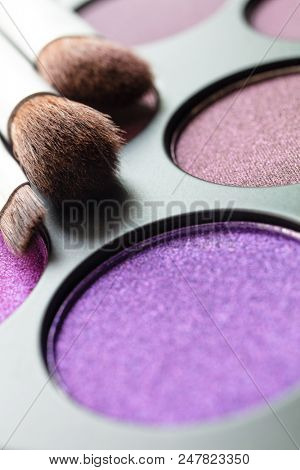 Macro close up photogaph of make up or makeup pallet and brushes