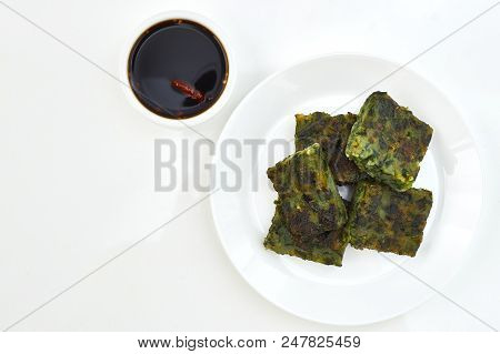 Top View Of Fried Chinese Pancake Or Fried Steamed Dumpling Made Of Garlic Chives, Rice Flour And Ta