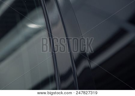 Tinted Black Car Windows That Reflect The Glass Ceiling