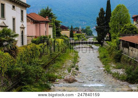Amazing Italian Town Mandello With Lovely Houses, Trees And Alps In Background. Concept Of Countrysi