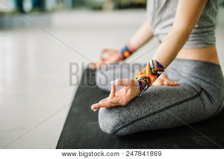 Cropped View Of Female Hands Practicing Yoga Position Training In Club, Studio. Wellness And Wellbei