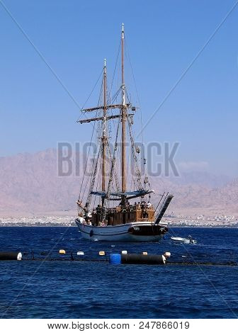 Eilat, Israel - September 30, 2005: Israeli Pleasure Yacht In The Red Sea Against The Backdrop Of Aq