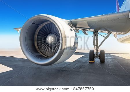 Wing Jet Engine Of The Airplane At The Airport Apron
