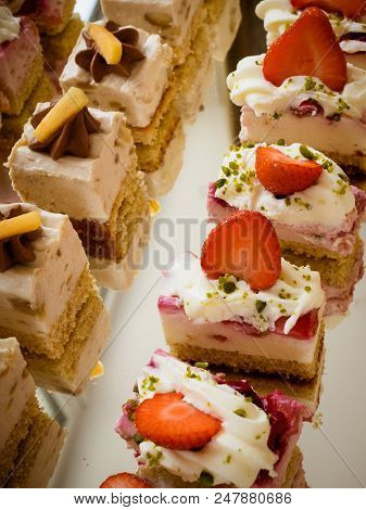 Wedding Cakes Set On Glass Shelf Minicake