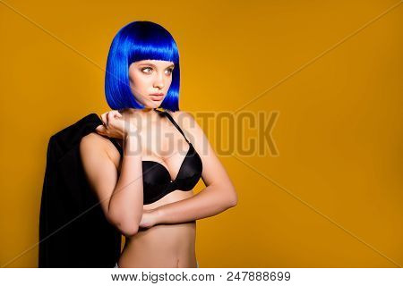 Portrait Of Half Turned Serious Hot Woman In Bright Blue Wig Having Big Tits Holding Jacket In Hand