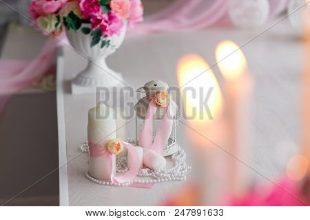 Beautiful Decor Of Candles And Flowers. White Pink Shades.