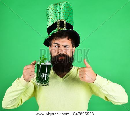 St Patrick's Day. Serious Man Holds Glass Of Beer On St.patrick's Day. Saint Patrick's Day Concept -
