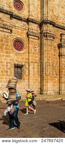 Cartagena, Colombia. March 2018. A View Of A Hat Seller Outside The Cathedral San Pedro Claver In Ca