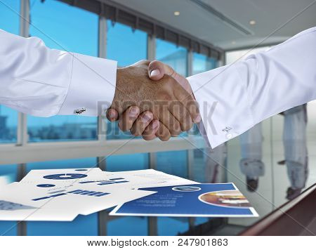 Saudi Arab Businessmen Shaking Hands, And Making Agreement Or A Deal