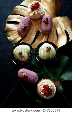 Moscovie Cakes Purple And Lemon Yellow. Pistachio And Fruit. Meringue Anna Pavlova . Culinary Art. G