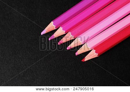 Pink Colored Pencils, Selective Focus, Black Background