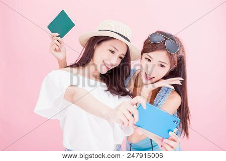 Two Travel Woman Selfie Happily With Travel Concept On The Pink Background