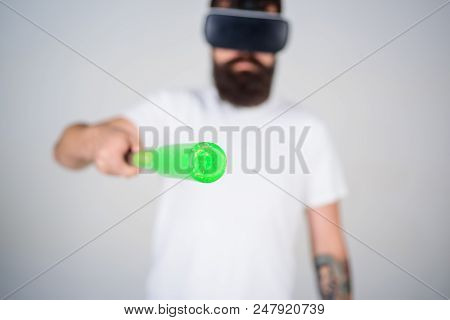 Man With Beard In Vr Glasses Holds Baseball Bat, Grey Background. Vr Sportsman Concept. Guy With Vr 