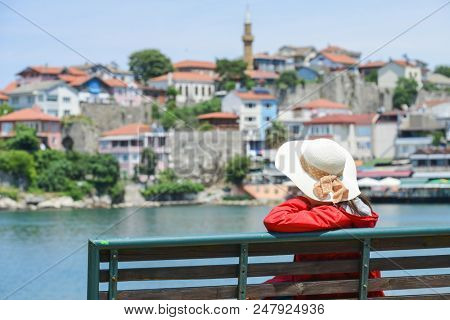 A tourist enjoys amazing view of Historical Amasra - Amasra town, Bartin - Turkey