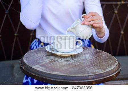 With Milk Tastes Better. Tips For Healthier Coffee Drinking. Hand Female Adding Pouring Milk To Blac