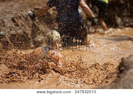Mud Race Runners During Extreme Obstacle Races