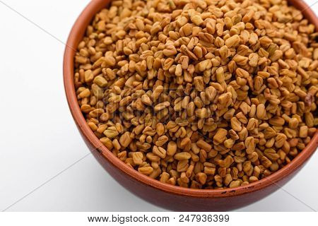 Fragrant Grains Of Fenugreek On A White Background.