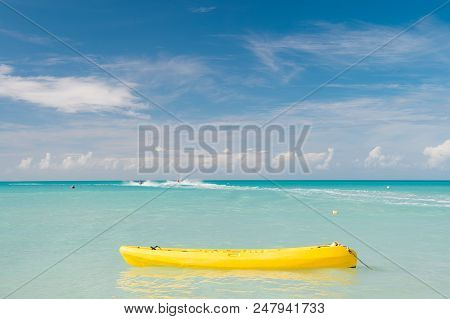 Enjoy Summer. Spend Vacation Exciting Occupation St.johns Antigua. Sea Turquoise Water Yellow Canoe 