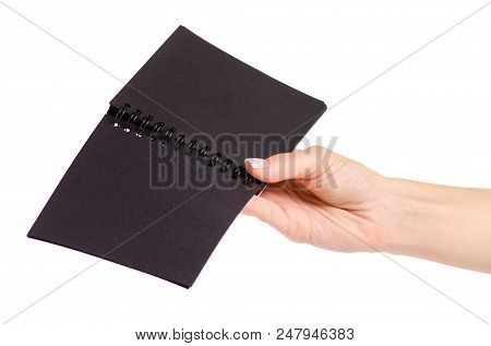 Notepad With Black Paper In Hand On White Background Isolation
