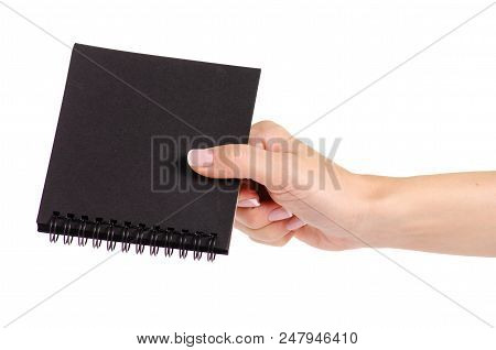 Notepad With Black Paper In Hand On White Background Isolation