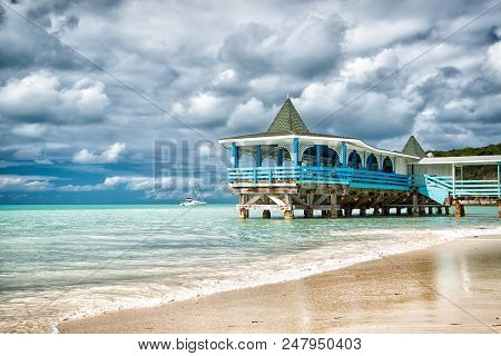 Sea Bungalow Holidays. Sea Turquoise Water And Bungalow House. Vacation Sea Sand Beach Tropical Hous