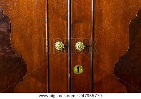Brass Knobs On An Antique Chifforobe, Armoire Or Wardrobe
