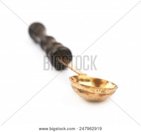 Wax Melting Spoon Laddle Isolated Over The White Background