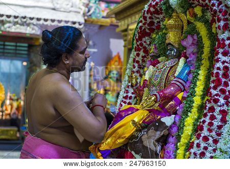 Singapore - Feb 24 : Indian Man Decorating Idol In Sri Veeramakaliamman Temple In Little India, Sing