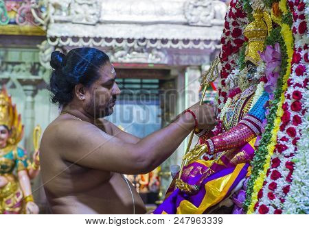 Singapore - Feb 24 : Indian Man Decorating Idol In Sri Veeramakaliamman Temple In Little India, Sing