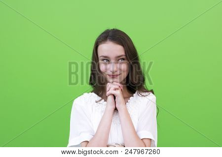 Portrait Of Suspicious And Thoughtful Young Charming Female In White Dress. Smiling Girl Keeping Han