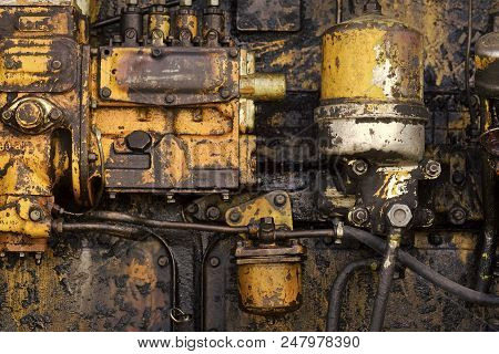Tractor Engine. Machinery With Oil Dirt On Grunge Metal Background. Industry, Engineering, Machine. 