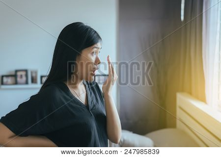 Bad Smell,asian Woman Covering Her Mouth And Smell Her Breath With Hands Upter Wake Up