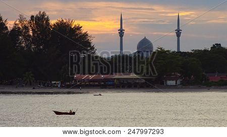 Sceninc View Over The City At The Sunset Time At Labuan Island Beach At Sunset With Fishing Boat And