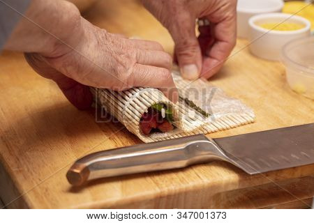 Sushi Roll Being Made In A Demonstaration Class