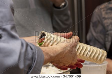 Sushi Roll Being Made In A Demonstaration Class