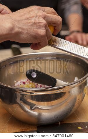 Sushi Roll Being Sliced In A Demonstaration Class